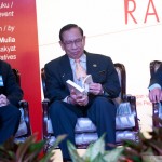 Dewan Negara president Tan Sri Abu Zahar Ujang browsing through his copy of the book.