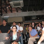 Audience laughing in response while the speakers poked fun at each other.