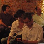 Pua massages his Blackberry while waiting for Khairy to arrive.