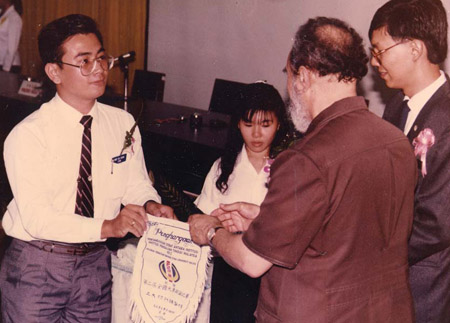 As a student, participating in an inter-varsity debate. He received a souvenir from former Universiti Malaya vice-chancellor Prof Syed Hussein Al-Attas