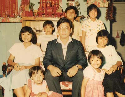 With his sisters and cousins in his family's old wooden house in Kampung Air Baruk, Malacca. 