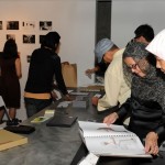 Guests leafing through the WORKING book.