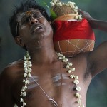 A moment of sorrow by an eldest son in mourning. He walks around a pyre counter-clockwise, reflecting that everything is backwards at the time of death. (Pic by Nafise Motlaq)