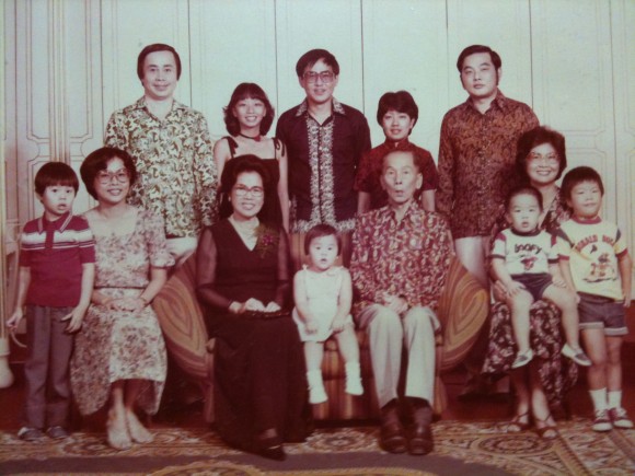 Bon’s maternal side of the family. His sister is seated in between their grandparents. Bon is standing far left in red with his mother sitting next to him and his father standing behind. (Pic courtesy of Edmund Bon)