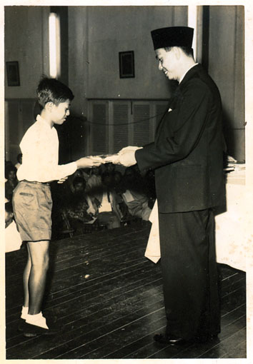 Zaid receiving a prize when he was in Standard 6