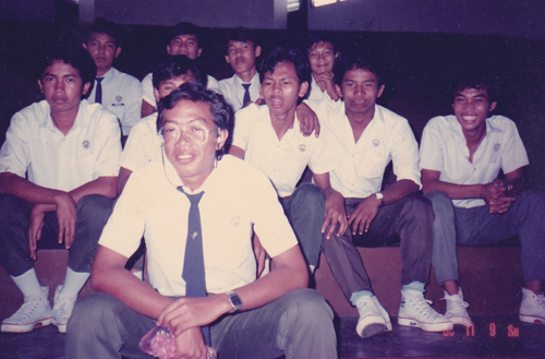 With his secondary-school friends. Bayu is in the middle row, third from left. 
